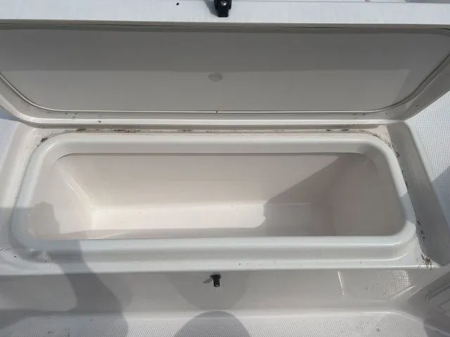 Slide: The Image of Open storage compartment in 2024 Yamaha Boats 190 FSH Sport. - 21
