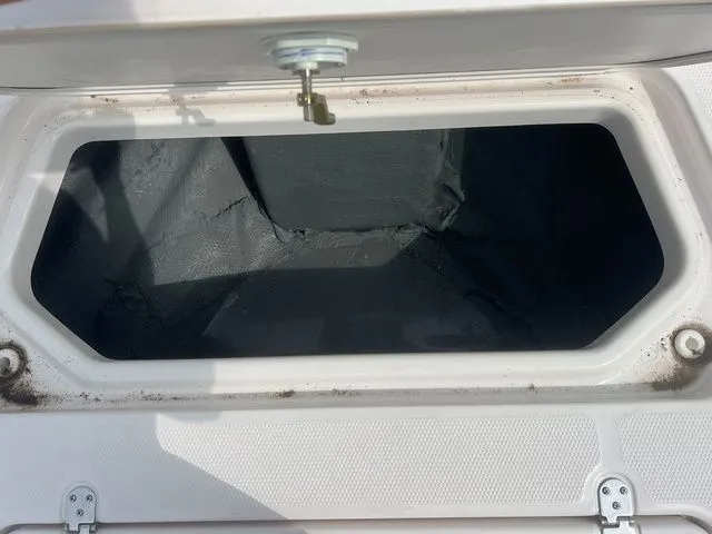 Slide: The Image of Open storage compartment in Yamaha 190 FSH Sport 2024 boat. - 23