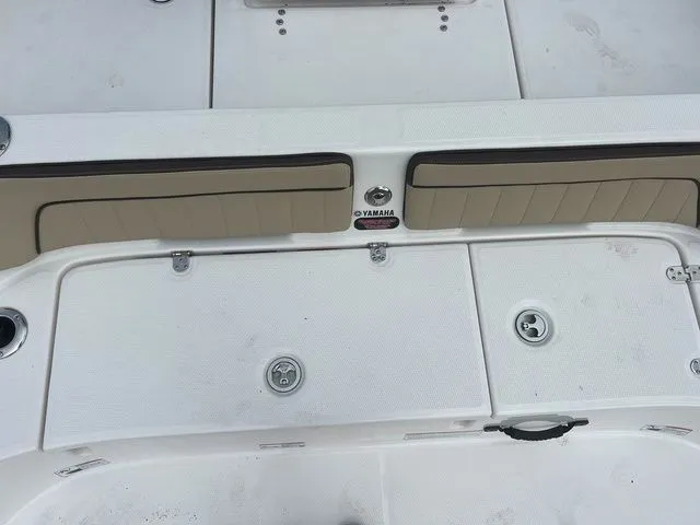 Slide: The Image of Yamaha Boats 2024 190 FSH Sport, white deck with storage compartments. - 28
