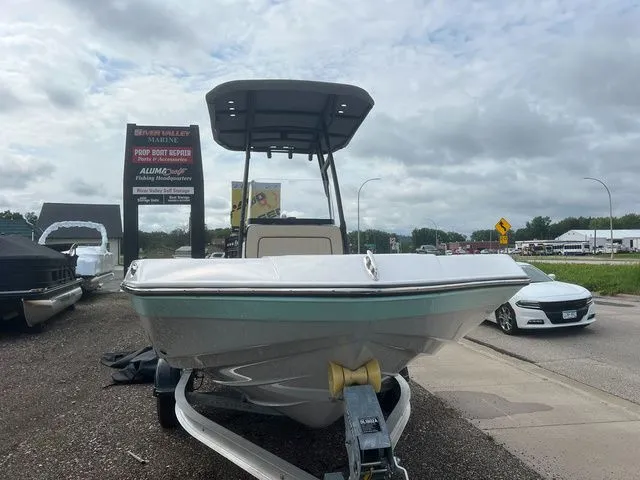 Slide: The Image of 2024 Yamaha 190 FSH Sport boat on trailer outdoors. - 3
