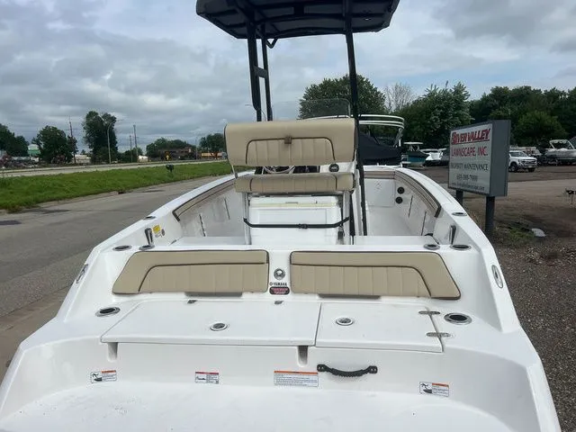 Slide: The Image of 2024 Yamaha Boats 190 FSH Sport on a parking lot. - 5