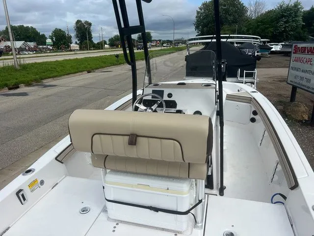 Slide: The Image of 2024 Yamaha Boats 190 FSH Sport on a parking lot. - 6