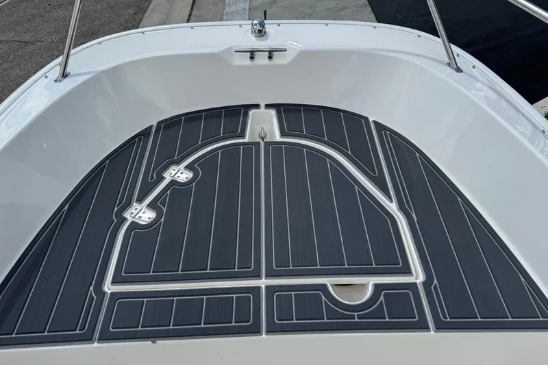 Slide: The Image of 2017 Boston Whaler 170 Super Sport boat deck with sleek black non-slip surface. - 16