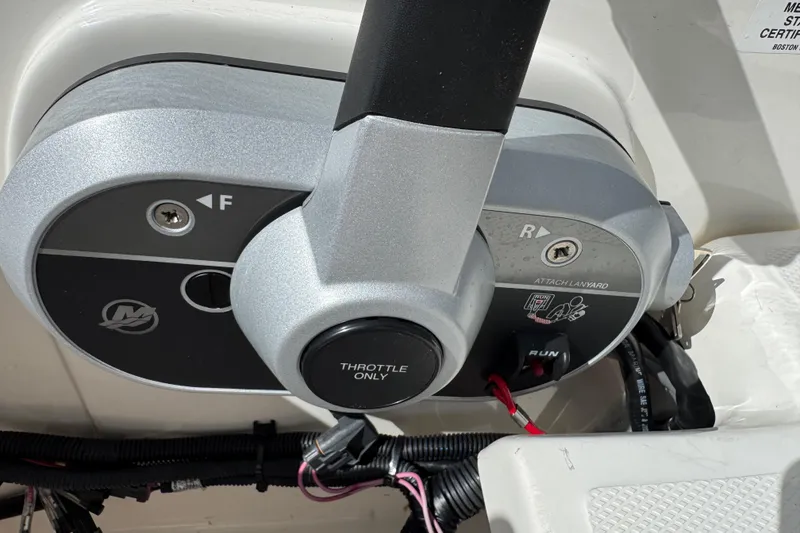 Slide: The Image of Throttle control panel of a 2017 Boston Whaler 170 Super Sport boat. - 18