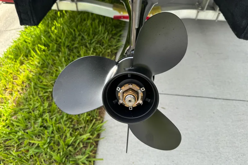Slide: The Image of Propeller of a 2017 Boston Whaler 170 Super Sport boat on grass and pavement. - 35