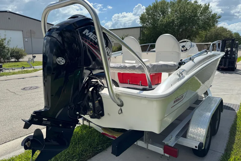 Slide: The Image of 2017 Boston Whaler 170 Super Sport boat on trailer with Mercury outboard motor. - 7