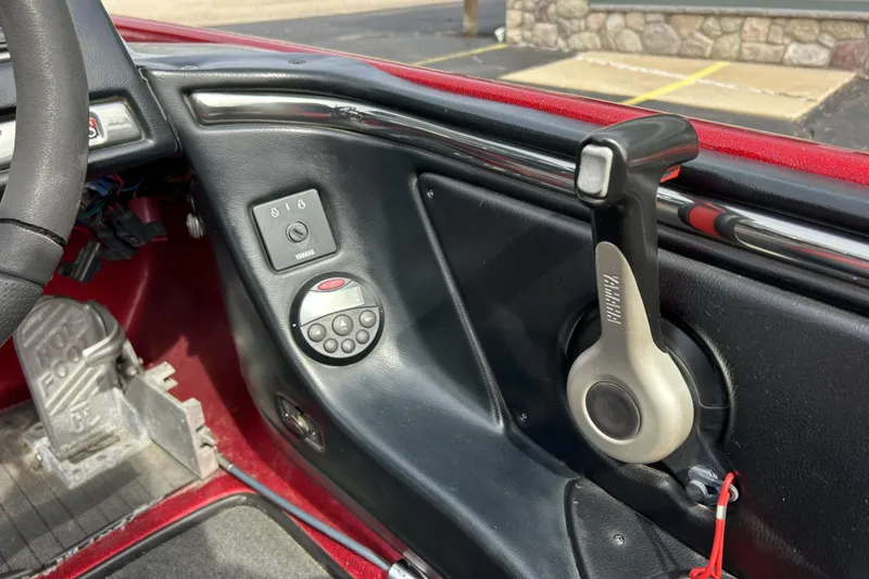 Slide: The Image of Interior of a 2007 Skeeter 20i boat showing controls and steering details. - 12