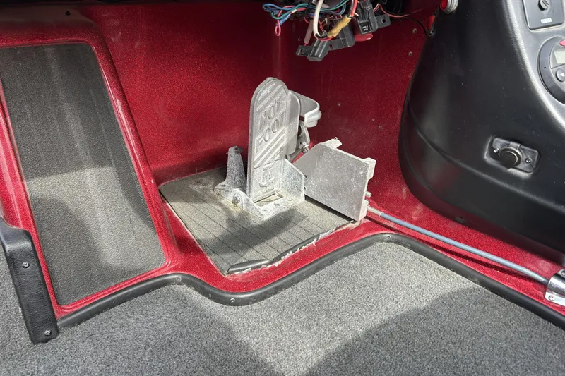 Slide: The Image of 2007 Skeeter 20i boat foot pedal and wiring detail in red interior. - 13