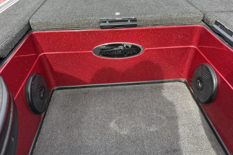 Slide: The Image of 2007 Skeeter 20i boat interior with red metallic finish and speaker details. - 14