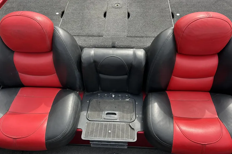 Slide: The Image of Red and black seats in a 2007 Skeeter 20i boat interior. - 20