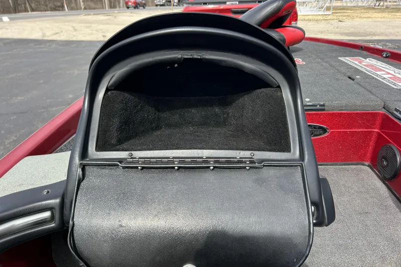 Slide: The Image of 2007 Skeeter 20i boat dashboard with storage compartment, red and black interior. - 22