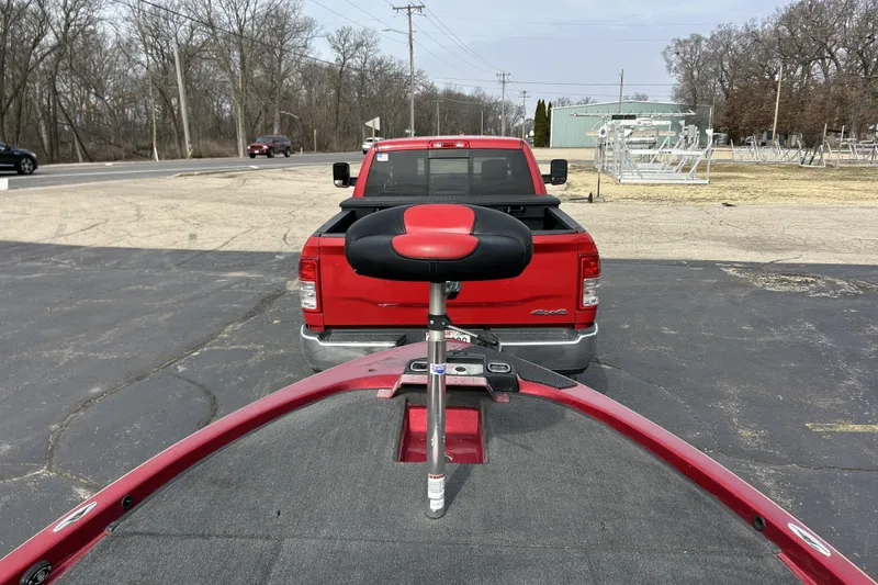 Slide: The Image of Red Skeeter 20i boat from 2007, parked behind a red pickup truck. - 31