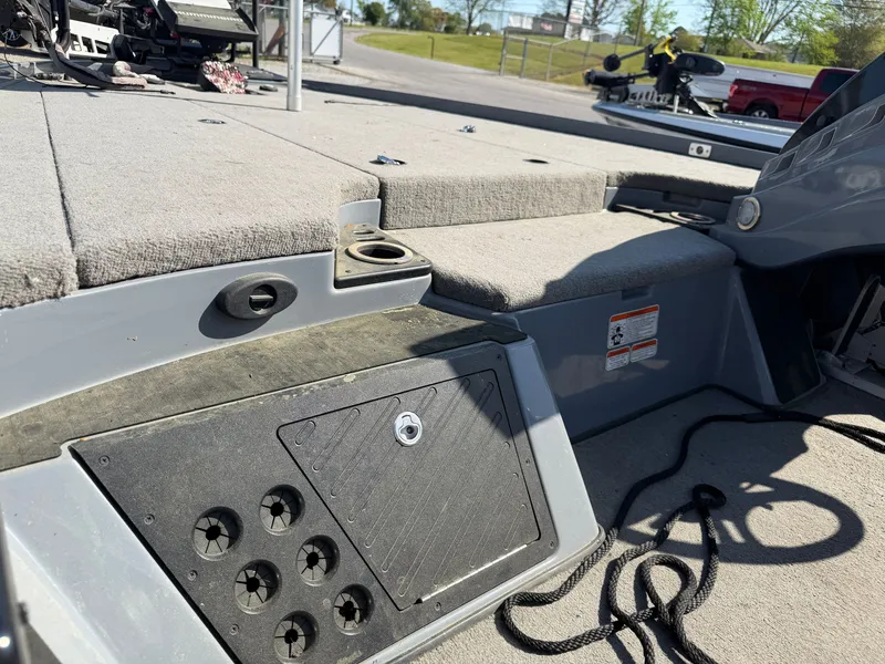 Slide: The Image of Interior of a 2021 Nitro Z20 boat with gray carpet flooring. - 9