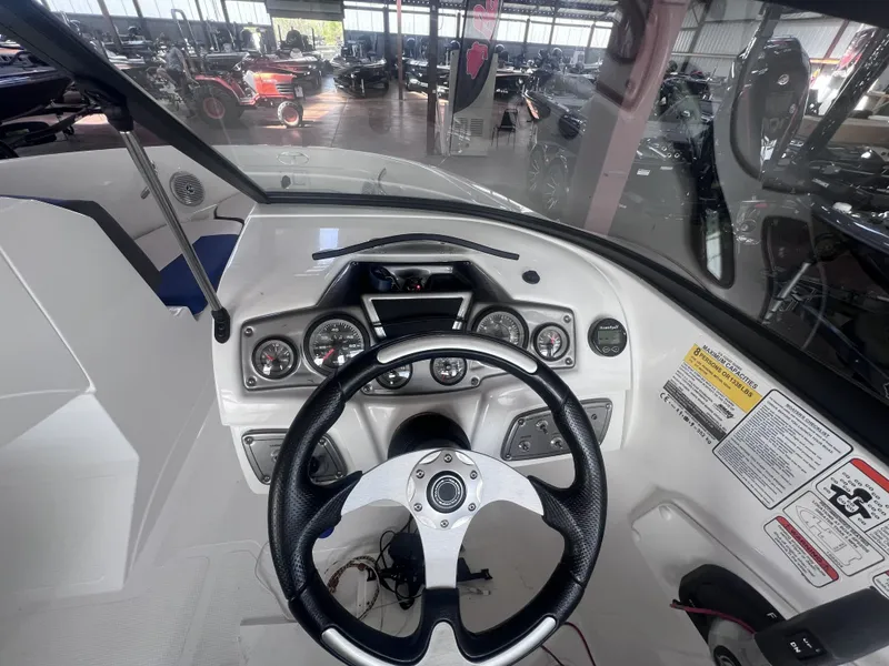 Slide: The Image of Interior view of 2022 Tahoe 200S boat cockpit with controls. - 10