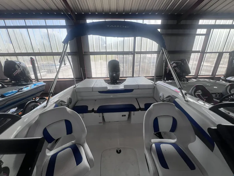 Slide: The Image of Interior view of a 2022 Tahoe 200S boat with blue seating. - 12