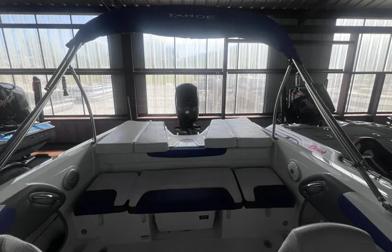 Slide: The Image of Interior view of a 2022 Tahoe 200S boat in showroom. - 13