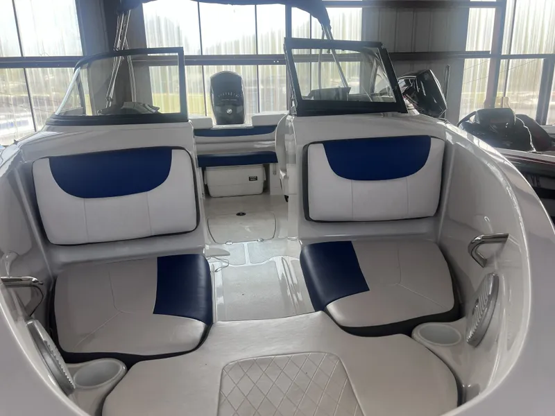 Slide: The Image of Interior of 2022 Tahoe 200S boat with blue and white seating. - 14
