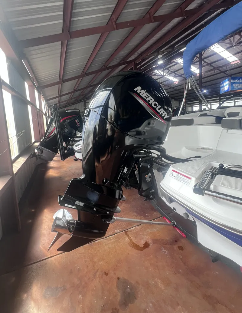 Slide: The Image of 2022 Tahoe 200S boat with Mercury outboard motor. - 7