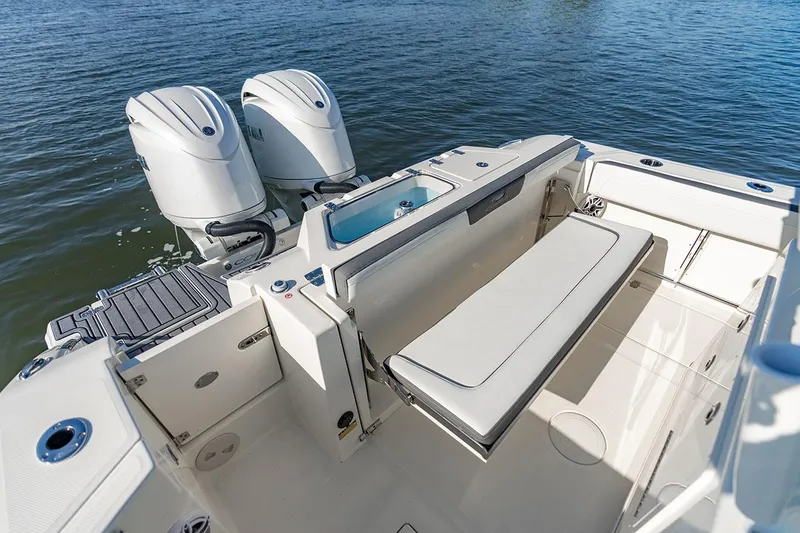 Slide: The Image of Manufacturer Provided Image: 2026 Cobia 245 Center Console boat with dual engines and spacious seating area. - 13
