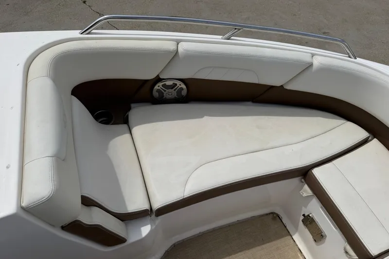 Slide: The Image of 2014 Chaparral 257 SSX boat interior with white and brown seating. - 18