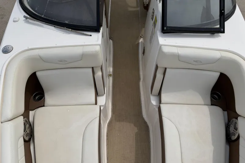 Slide: The Image of Interior view of 2014 Chaparral 257 SSX boat with white seating and cup holders. - 21
