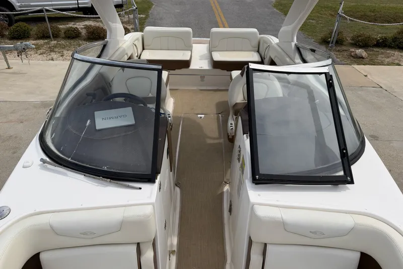 Slide: The Image of 2014 Chaparral 257 SSX boat interior with open windshield and seating area. - 22