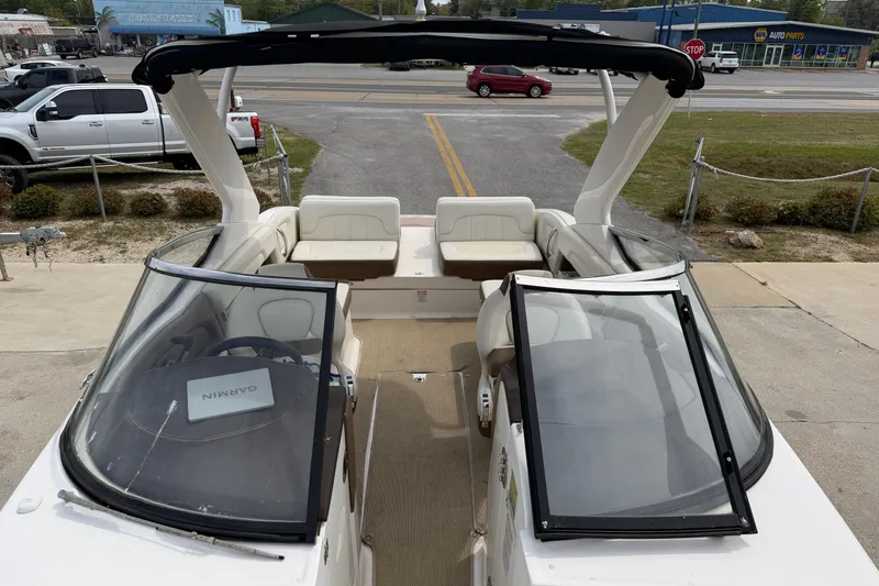Slide: The Image of 2014 Chaparral 257 SSX boat with open cockpit and Garmin navigation system. - 23