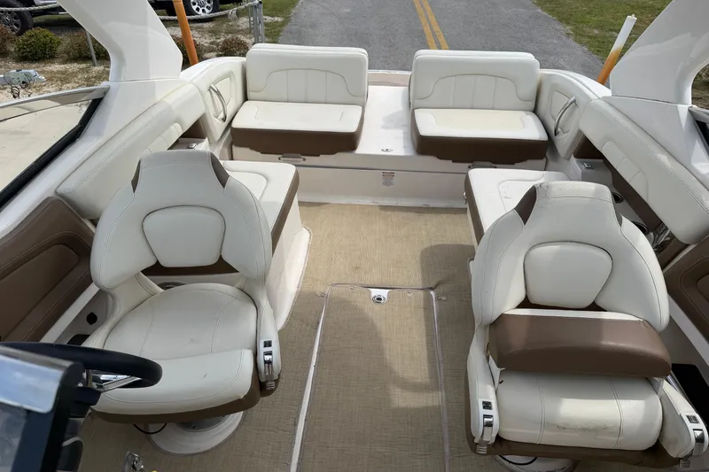 Slide: The Image of Interior of 2014 Chaparral 257 SSX boat with white and brown seating. - 24