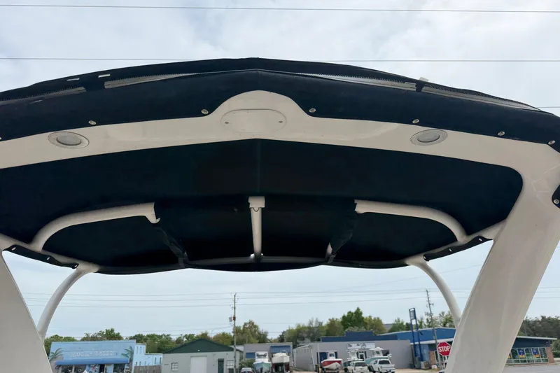 Slide: The Image of 2014 Chaparral 257 SSX boat canopy viewed from below, showcasing sleek design. - 25