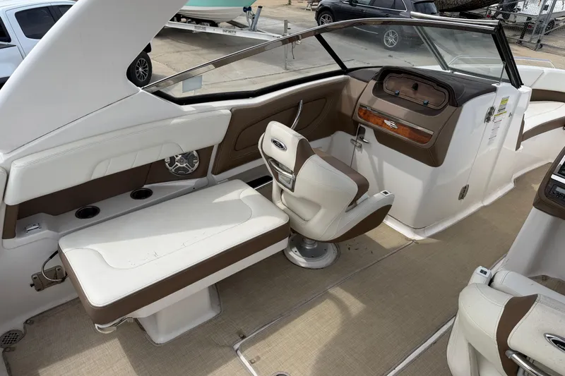 Slide: The Image of Interior of a 2014 Chaparral 257 SSX boat, featuring seating and dashboard. - 27