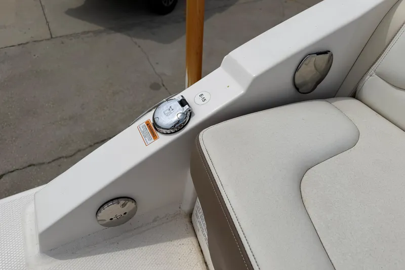 Slide: The Image of 2014 Chaparral 257 SSX boat interior detail with fuel cap and seating. - 32