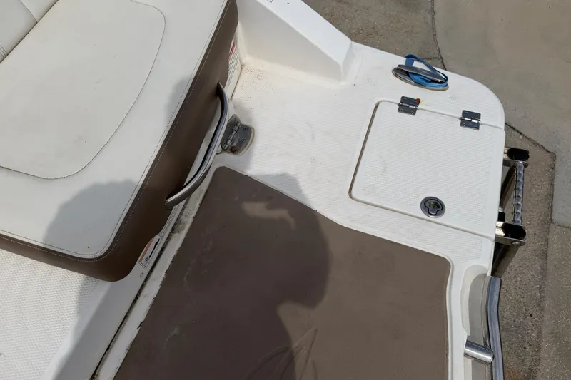 Slide: The Image of 2014 Chaparral 257 SSX boat deck with seating and storage compartment. - 35