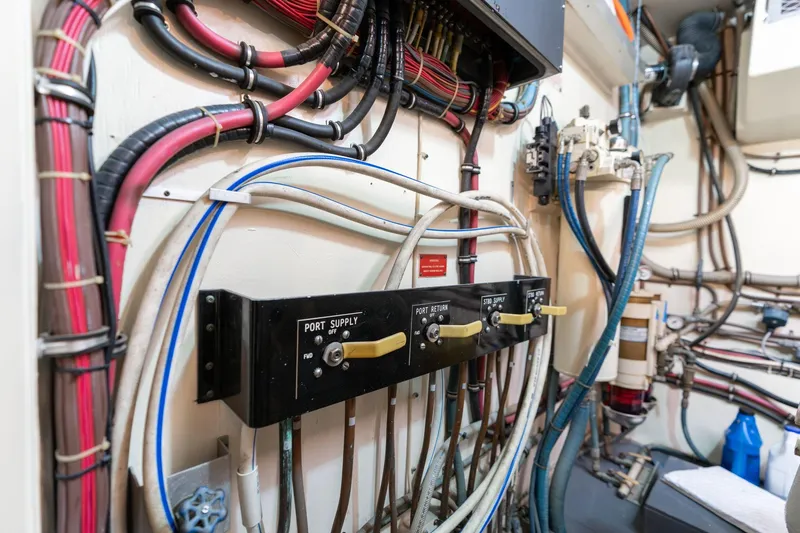 Slide: The Image of Engine room wiring and controls of a 1986 Hatteras 63 Motor Yacht. - 115