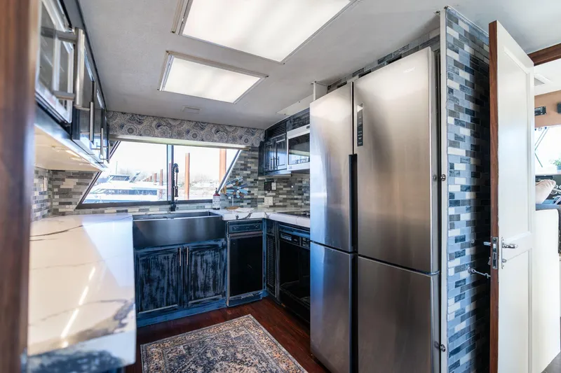 Slide: The Image of Modern kitchen interior of 1986 Hatteras 63 Motor Yacht with stainless steel appliances. - 12
