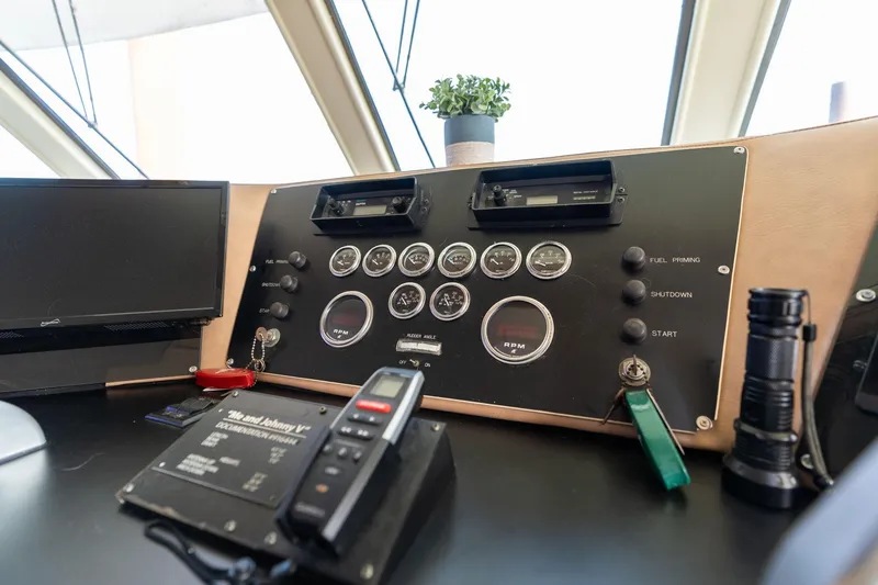Slide: The Image of Control panel of a 1986 Hatteras 63 Motor Yacht with gauges and equipment. - 120