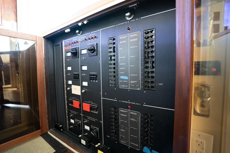 Slide: The Image of Electrical control panel on a 1986 Hatteras 63 Motor Yacht. - 128