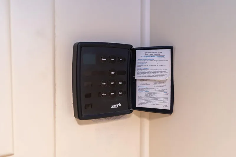 Slide: The Image of Control panel on 1986 Hatteras 63 Motor Yacht with operation instructions visible. - 129