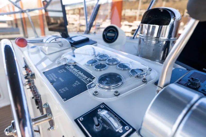 Slide: The Image of Control panel of a 1986 Hatteras 63 Motor Yacht with gauges and controls. - 133