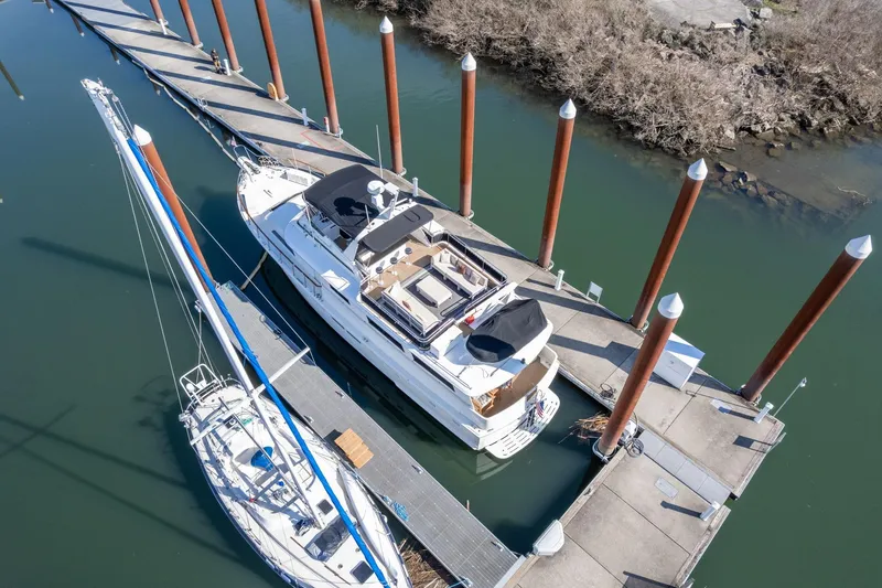 Slide: The Image of Aerial view of 1986 Hatteras 63 Motor Yacht docked at marina. - 142