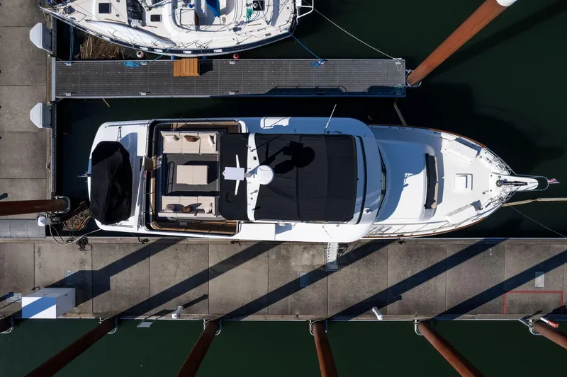 Slide: The Image of Aerial view of 1986 Hatteras 63 Motor Yacht docked at marina. - 147