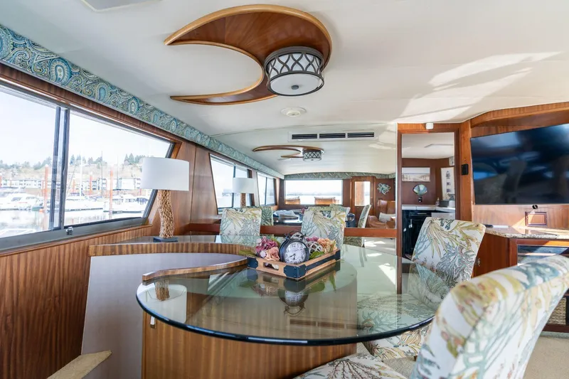 Slide: The Image of Interior of 1986 Hatteras 63 Motor Yacht with elegant dining area and large windows. - 31