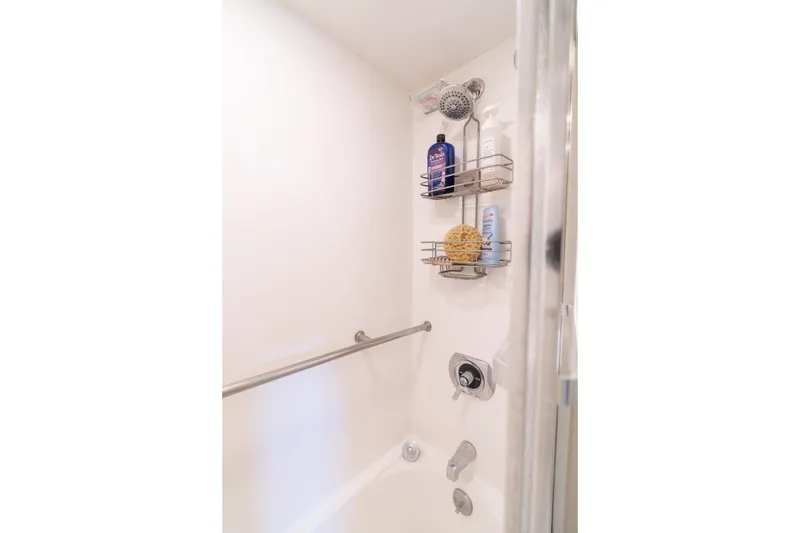 Slide: The Image of Shower area in 1986 Hatteras 63 Motor Yacht with toiletries and grab bar. - 45