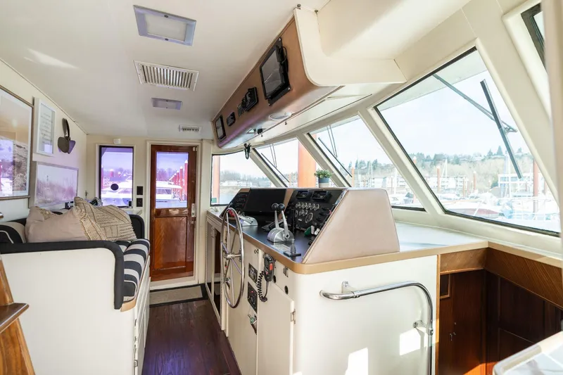 Slide: The Image of Interior of a 1986 Hatteras 63 Motor Yacht with helm and seating area. - 46