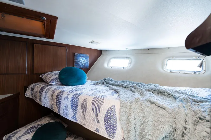 Slide: The Image of Cozy cabin interior of 1986 Hatteras 63 Motor Yacht with nautical decor. - 54