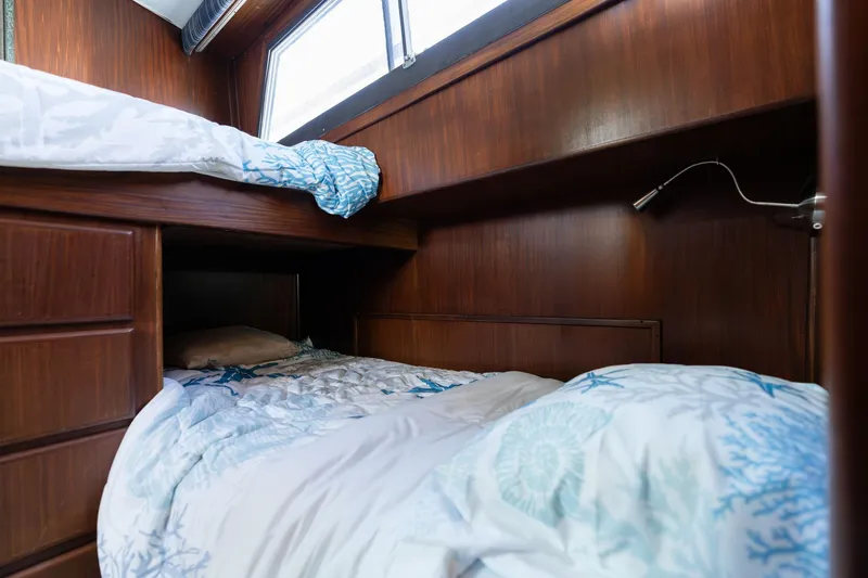 Slide: The Image of Cozy cabin with bunk beds in 1986 Hatteras 63 Motor Yacht. - 59