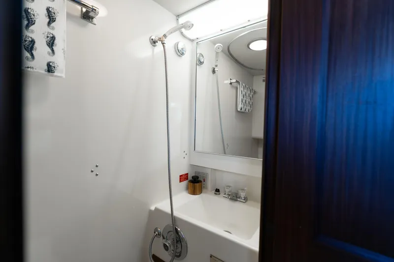 Slide: The Image of Bathroom interior of 1986 Hatteras 63 Motor Yacht with shower and sink. - 61