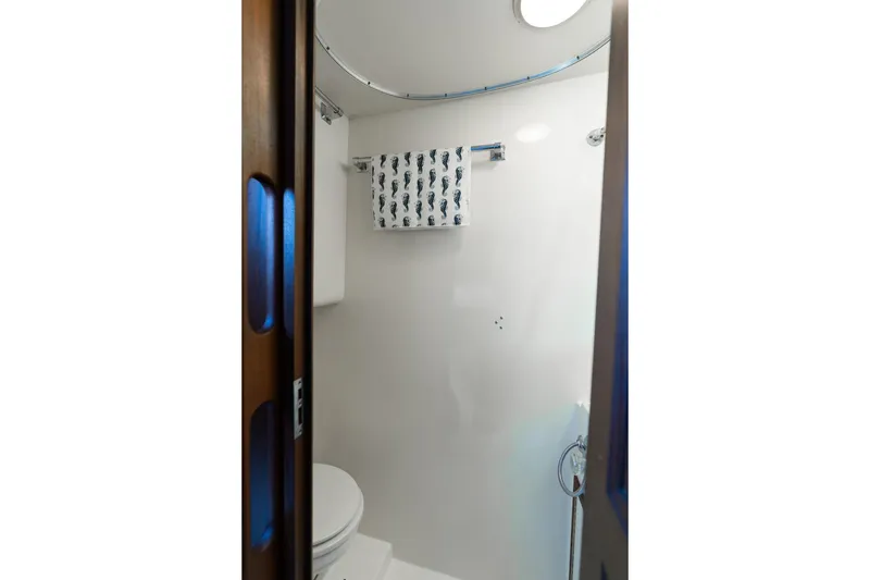 Slide: The Image of Bathroom interior of 1986 Hatteras 63 Motor Yacht with towel and shower. - 62