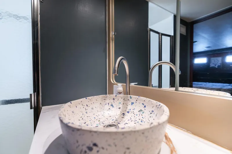 Slide: The Image of Modern bathroom sink with terrazzo basin on 1986 Hatteras 63 Motor Yacht. - 68