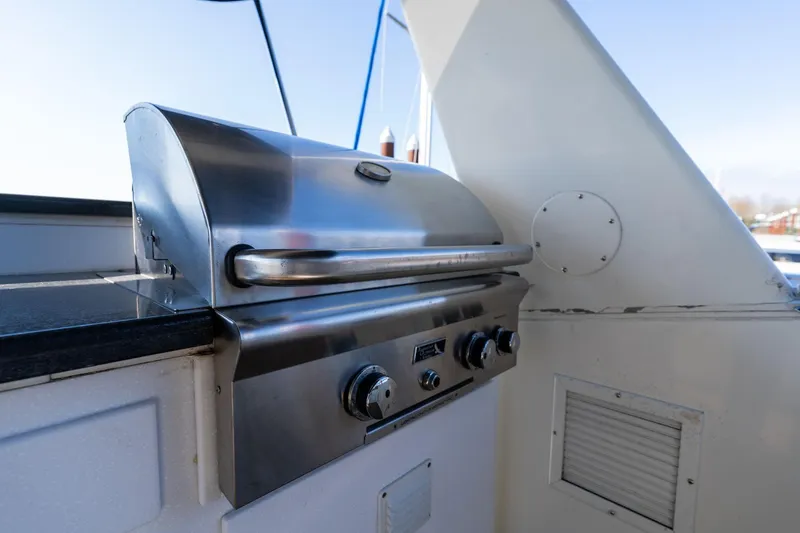 Slide: The Image of Stainless steel grill on 1986 Hatteras 63 Motor Yacht deck, ready for outdoor cooking. - 84