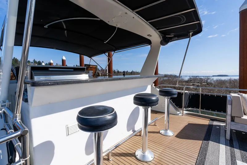 Slide: The Image of Outdoor bar area on 1986 Hatteras 63 Motor Yacht with ocean view. - 86
